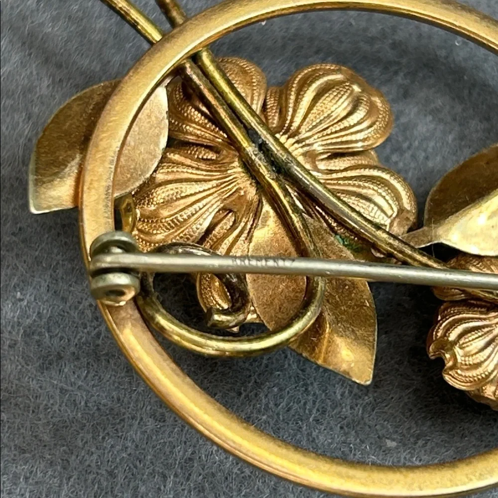 vintage Krementz brooch featuring floral designs in a mixed rose and yellow gold